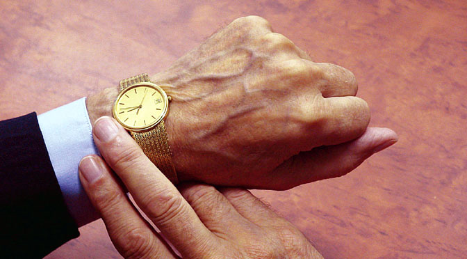 Looking at a gold watch